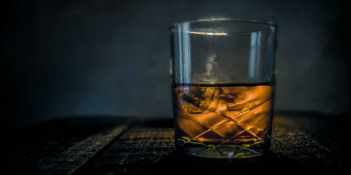 Bourbon in a glass at a bar