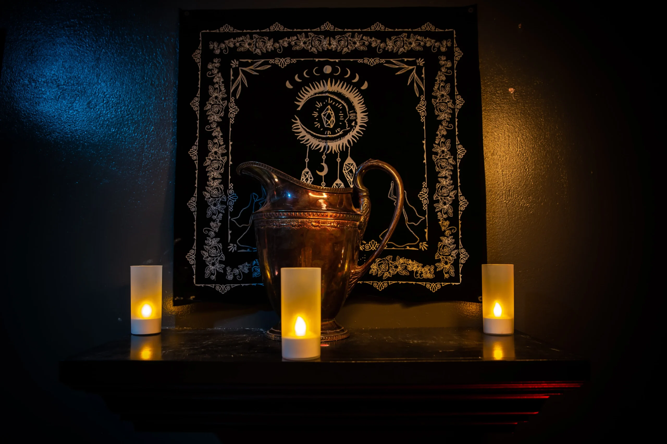 Candlelit speakeasy display with dark mystical décor, setting the eerie mood for Ghost Stories show at 1923 Prohibition Bar in Las Vegas.